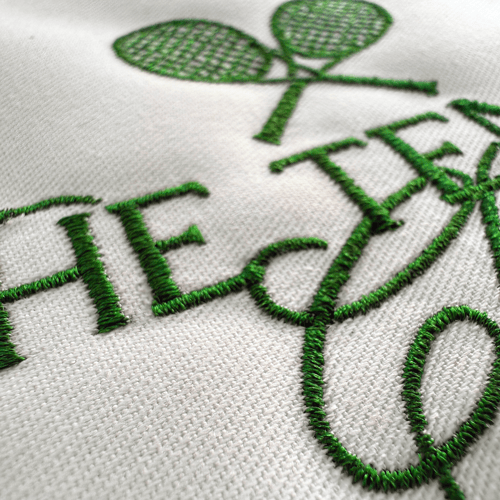 Close-up embroidery digitizing sample – satin stitch lettering detail by ProDigitizing.