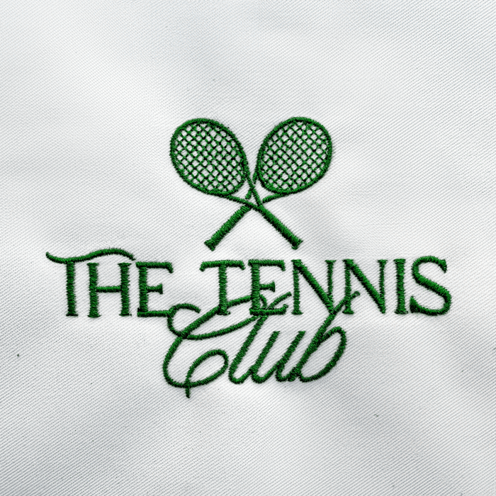 Professionally digitized embroidery of two crossed tennis rackets above elegant, flowing text. Clean satin stitches with sharp curves, even spacing, and smooth underlay create a polished finish. Thread tension is balanced, producing crisp edges and consistent fill on white fabric.